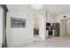 Bright living room featuring neutral colors, an arched doorway, and a view of the kitchen and dining area at 2625 Brookville Dr, Valrico, FL 33596