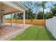 Covered patio with brick pavers offering a serene outdoor living space with views of lush landscaping at 2625 Brookville Dr, Valrico, FL 33596