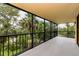 Screened balcony with lush green outdoor views, perfect for relaxing and enjoying nature at 3062 Eastland Blvd # 308, Clearwater, FL 33761