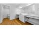 Contemporary bathroom featuring double sinks, quartz counters, and ample storage at 3062 Eastland Blvd # 308, Clearwater, FL 33761