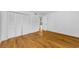Large bedroom featuring wood floors and a spacious closet with sliding doors at 3062 Eastland Blvd # 308, Clearwater, FL 33761