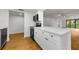 Bright kitchen featuring white cabinetry, stainless steel appliances, and modern countertops at 3062 Eastland Blvd # 308, Clearwater, FL 33761