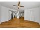 Spacious living room with a ceiling fan, wood-style floors, and an open floor plan at 3062 Eastland Blvd # 308, Clearwater, FL 33761