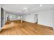 Spacious living room with open-concept design featuring wood-style floors and modern track lighting at 3062 Eastland Blvd # 308, Clearwater, FL 33761