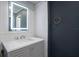 Bathroom with new vanity, cabinet, modern lit mirror and stainless steel hardware at 3125 Beaver Creek Dr, Wesley Chapel, FL 33543