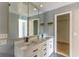 Bathroom features double sinks, a large mirror and walk-in closet at 3225 Rosery Ne Rd, Largo, FL 33771