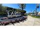 Welcome to Largo sign surrounded by lush greenery and flowers on a sunny day at 3225 Rosery Ne Rd, Largo, FL 33771