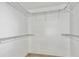 Walk-in closet with white wire shelving at 3225 Rosery Ne Rd, Largo, FL 33771