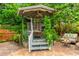 Outdoor entertaining in the gazebo with seating and cozy ambiance, surrounded by greenery at 3225 Rosery Ne Rd, Largo, FL 33771