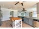 Updated kitchen with modern appliances, a butcher block island, and plenty of counter space at 3225 Rosery Ne Rd, Largo, FL 33771