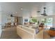 Well-designed living room and dining area with contemporary furniture and pool views at 3225 Rosery Ne Rd, Largo, FL 33771