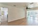 Open living room with tile floors leads to a water view and screened in patio at 3225 Rosery Ne Rd, Largo, FL 33771