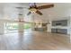 Spacious living room with wood floors, ceiling fans and lots of natural light at 3225 Rosery Ne Rd, Largo, FL 33771