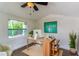 Bright office space with a window, a desk, and decor at 3225 Rosery Ne Rd, Largo, FL 33771
