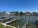 Waterfront property with multiple docks along the canal and lush landscaping at 326 Windrush Blvd # 103, Indian Rocks Beach, FL 33785