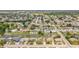 A charming neighborhood with waterfront access and tree-lined streets is captured in this aerial view at 4016 Grayton Dr, New Port Richey, FL 34652