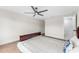 Bedroom features wood flooring, fan and ensuite bathroom with marble shower at 4016 Grayton Dr, New Port Richey, FL 34652