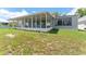 Rear exterior of home featuring enclosed patio at 4016 Grayton Dr, New Port Richey, FL 34652
