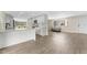 Bright kitchen with stainless appliances, white cabinets, and an open layout at 4016 Grayton Dr, New Port Richey, FL 34652