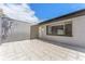 Private patio area with tiled flooring, perfect for outdoor relaxation and entertaining at 4016 Grayton Dr, New Port Richey, FL 34652
