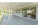 Covered back patio with sliding glass doors and neutral tones at 4016 Grayton Dr, New Port Richey, FL 34652