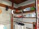 Basement features wooden support beams and shelves for storage at 4105 W Tyson Ave, Tampa, FL 33611