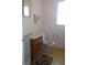 Cozy bathroom features a sink, toilet, window and towel rack at 4105 W Tyson Ave, Tampa, FL 33611
