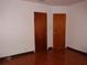 View of Bedroom showing floors and closet doors at 4105 W Tyson Ave, Tampa, FL 33611