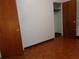 Bedroom features hardwood floors and two doors for access to other rooms at 4105 W Tyson Ave, Tampa, FL 33611