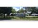 Cozy single-story home with a fenced yard and mature landscaping at 4105 W Tyson Ave, Tampa, FL 33611