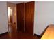Hallway featuring wood floors, access to other rooms, and neutral colored walls at 4105 W Tyson Ave, Tampa, FL 33611