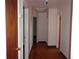 View of Hallway showing the doors and parquet floors throughout at 4105 W Tyson Ave, Tampa, FL 33611