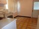 View of kitchen area, featuring white appliances, ample countertops and a view to the outside at 4105 W Tyson Ave, Tampa, FL 33611