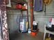 Utility room featuring a water heater, shelving, and supplies, providing essential home functions at 4105 W Tyson Ave, Tampa, FL 33611