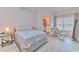 Cozy bedroom features natural light, a chair, and walk-in closet access at 4207 S Dale Mabry Hwy # 2101, Tampa, FL 33611