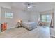 Light, airy bedroom with a ceiling fan and comfortable seating area at 4207 S Dale Mabry Hwy # 2101, Tampa, FL 33611