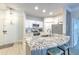 This kitchen features granite counters, white cabinets and bar stool seating at 4207 S Dale Mabry Hwy # 2101, Tampa, FL 33611