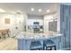 This kitchen features granite counters, white cabinets and bar stool seating at 4207 S Dale Mabry Hwy # 2101, Tampa, FL 33611