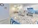 Bright kitchen featuring granite countertops, stainless appliances, and white cabinetry at 4207 S Dale Mabry Hwy # 2101, Tampa, FL 33611