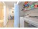 Convenient laundry area with updated appliances and extra storage shelves at 4207 S Dale Mabry Hwy # 2101, Tampa, FL 33611