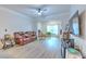 Cozy living room featuring lots of natural light and wood-look floors at 4207 S Dale Mabry Hwy # 2101, Tampa, FL 33611