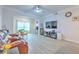 Living room featuring lots of natural light, ceiling fan and wood-look floors at 4207 S Dale Mabry Hwy # 2101, Tampa, FL 33611