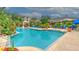 Large community pool surrounded by tropical landscaping and lounge chairs provides a relaxing oasis at 4207 S Dale Mabry Hwy # 2101, Tampa, FL 33611