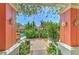 Framed view of a community pool features lush landscaping and colorful bougainvillea at 4207 S Dale Mabry Hwy # 2101, Tampa, FL 33611