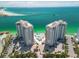 Stunning aerial view of beachfront condo towers with private beach and turquoise waters at 440 S Gulfview Blvd # 701, Clearwater Beach, FL 33767
