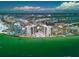 Aerial view of condo towers showing a unique community pool and stunning beachfront views at 440 S Gulfview Blvd # 701, Clearwater Beach, FL 33767