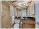 Bathroom with shower, marble countertop, recessed lights and a decorative mirror at 440 S Gulfview Blvd # 701, Clearwater Beach, FL 33767