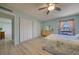 This bedroom features wood-look floors, closet space, and natural light at 440 S Gulfview Blvd # 701, Clearwater Beach, FL 33767