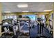 Well-equipped gym with treadmills, weights, and views of the outside at 440 S Gulfview Blvd # 701, Clearwater Beach, FL 33767