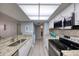 Updated kitchen boasts stainless steel appliances, granite counters and backsplash with lots of natural light at 440 S Gulfview Blvd # 701, Clearwater Beach, FL 33767